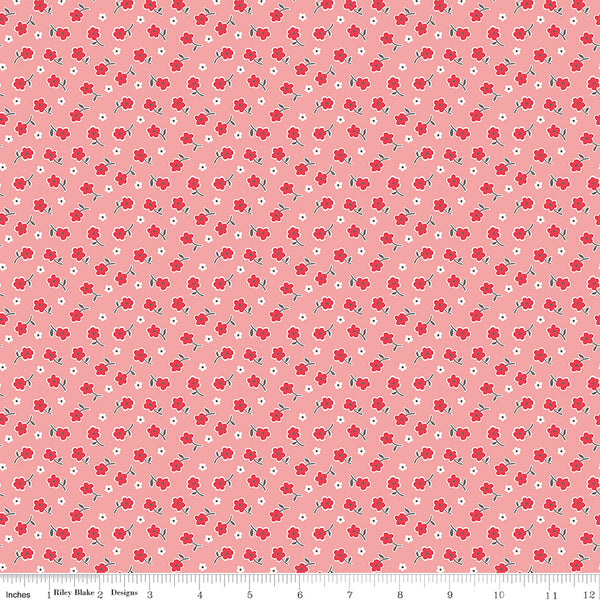 tiny red flowers on a pink-red fabric background