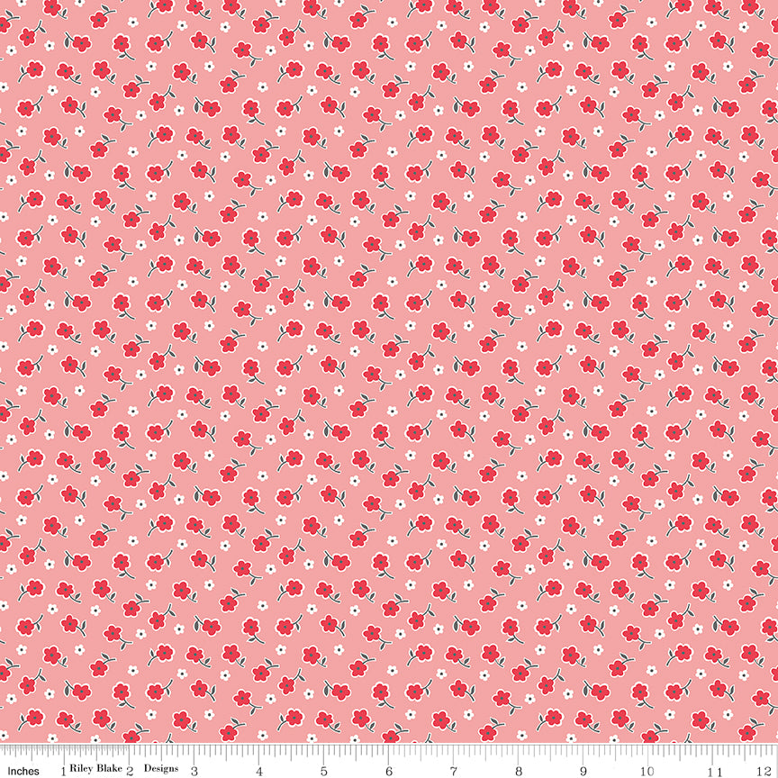 tiny red flowers on a pink-red fabric background